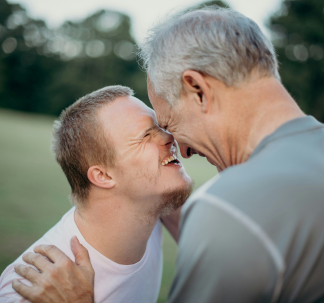 a man touching another man's face